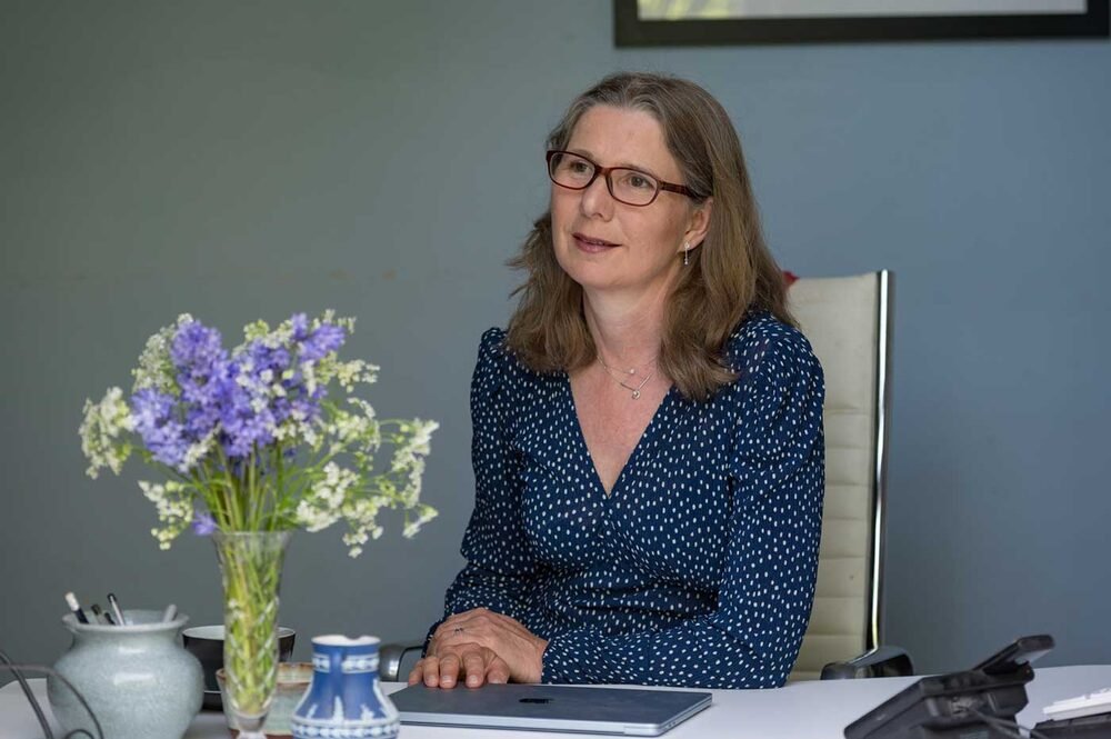 CEO at home-office desk — personal brand photography.