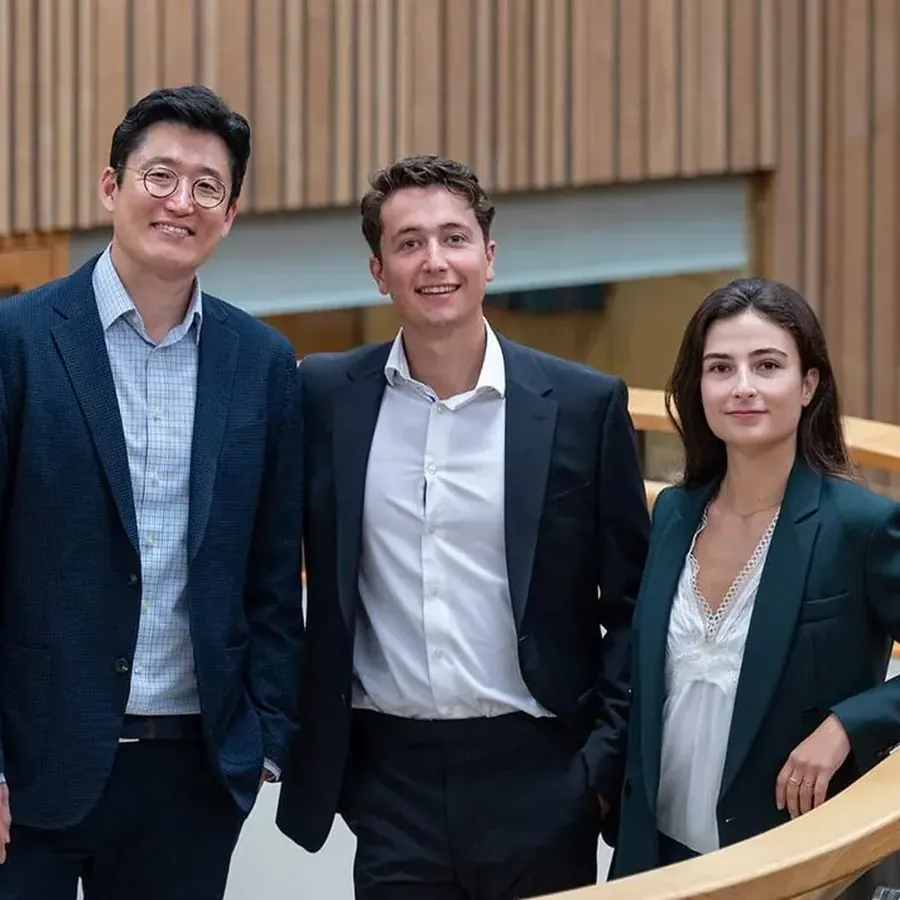 Team brand-library photograph for CardiaTec, three colleagues on a staircase, by Jean-Luc Benazet, Cambridge.