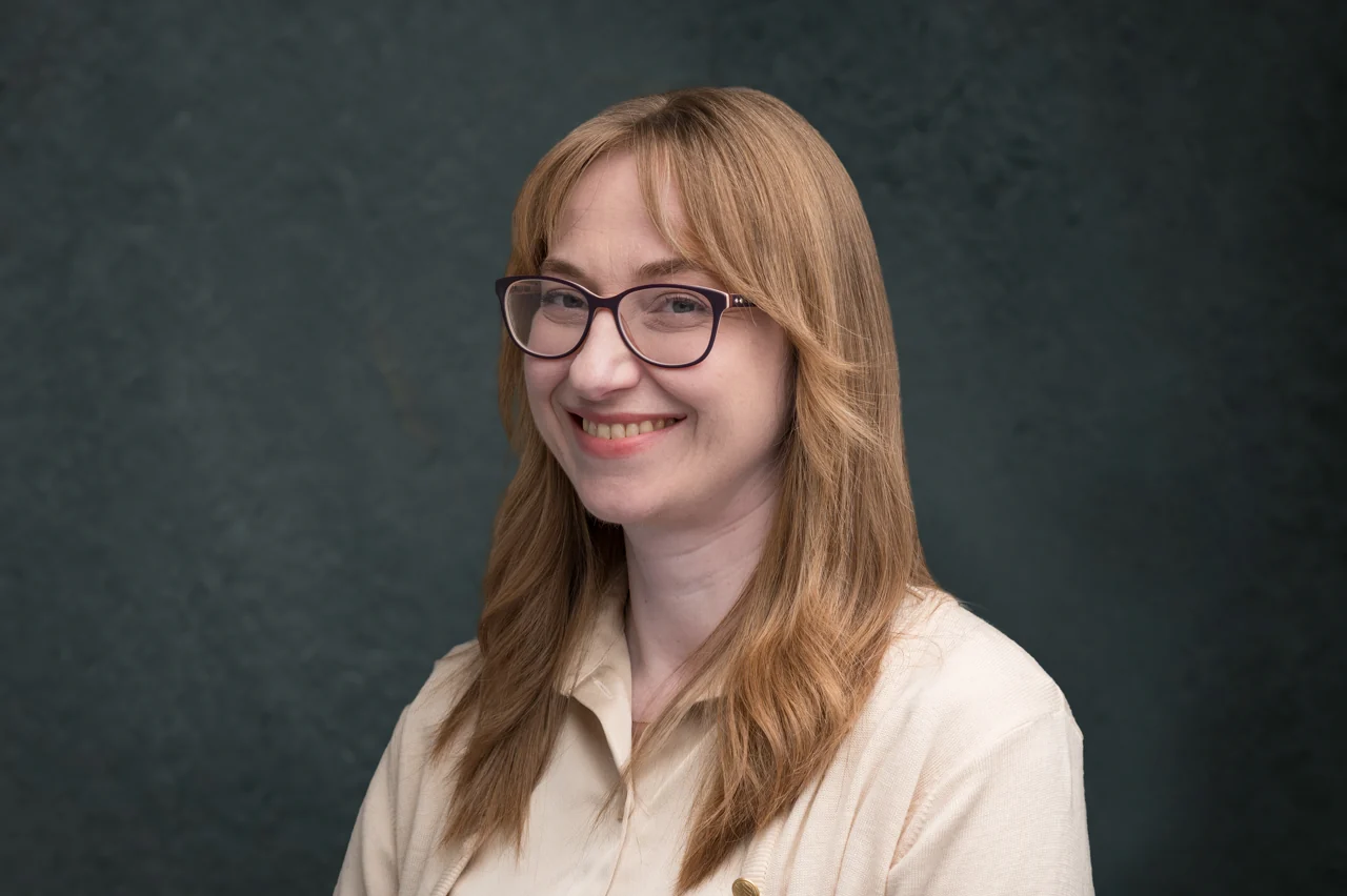 Company headshot for Armada against a dark textured backdrop