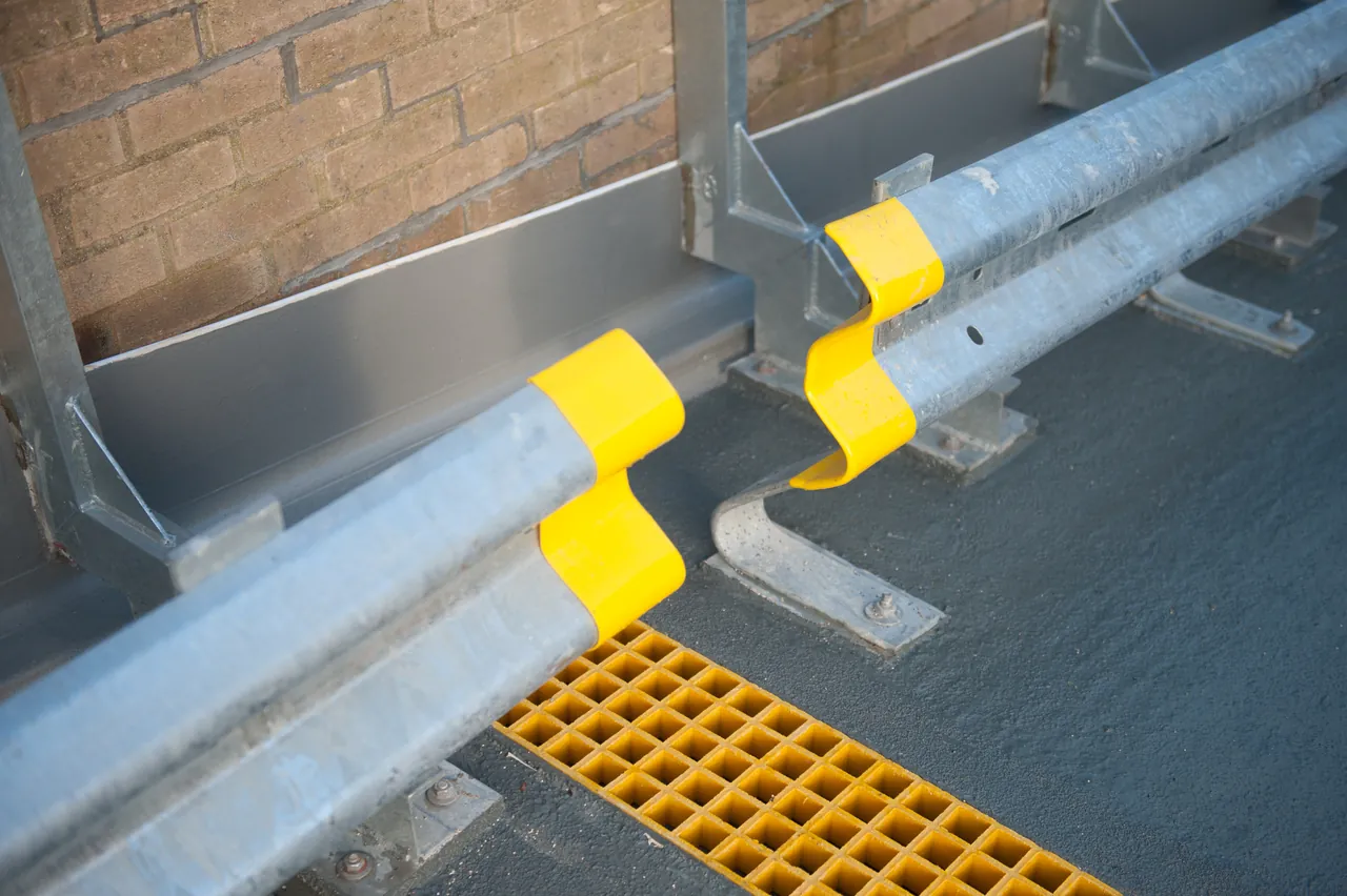 Yellow anti-slip flooring details on a car-park ramp