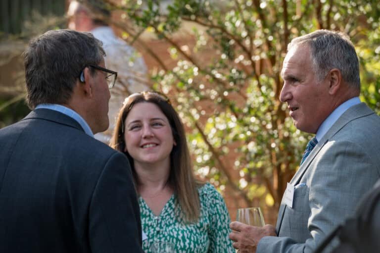 Professional corporate photographers capturing business networking events in outdoor settings | Expert corporate photography UK.