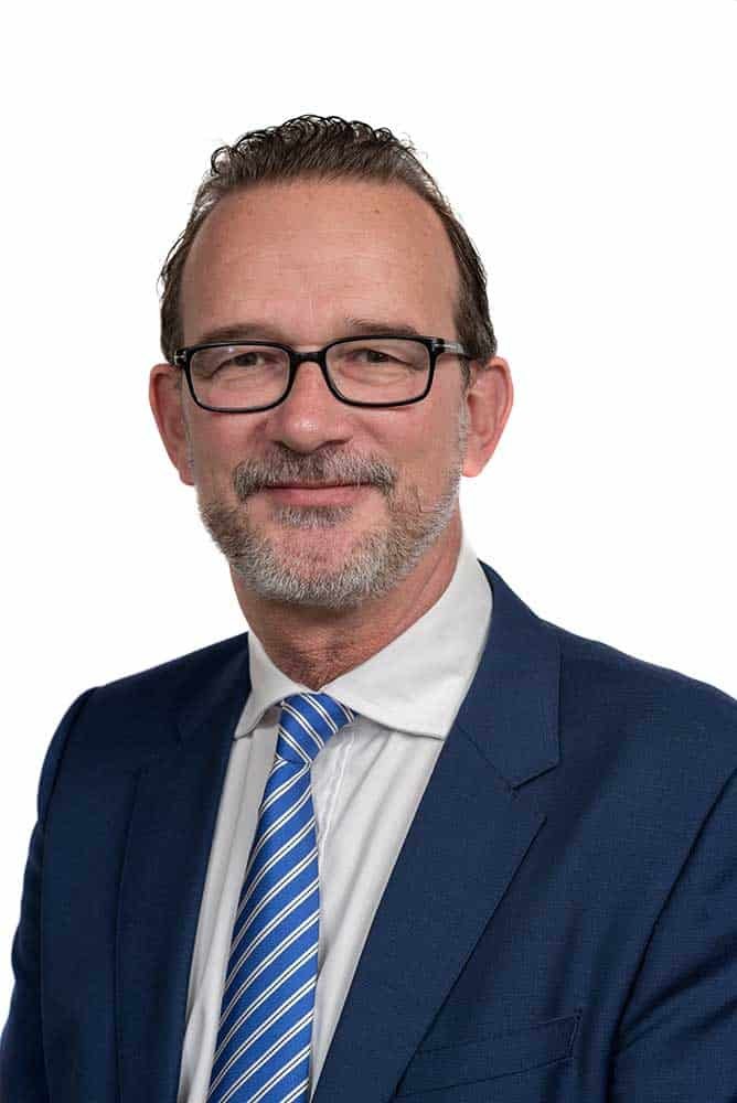 Corporate portrait of a businessman in suit and tie for professional headshots.