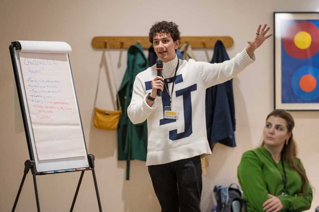 Corporate photographer capturing a speaker at a business event in Cambridge.